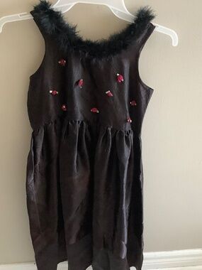 Satin black girl’s dress from Pam Chorley